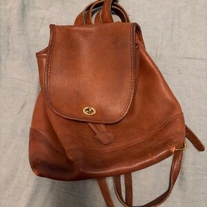 Well loved medium vintage Coach daypack turn lock in tan